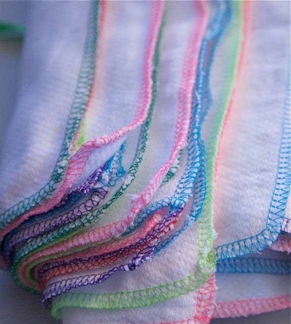 Reusable 12 Multi color trimmed napkins