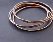 Set of five hammered copper bracelets formed and heat treated for a unique and modern look and splash of fall colors - "Desert Bangles"