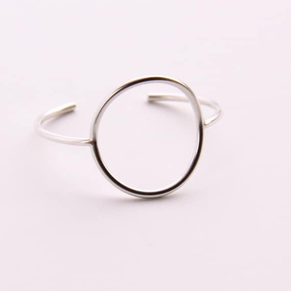 Minimalist silver bracelet of a focal circle shape forged, soldered and hand formed into comfortable, elegant wrist jewelry - "Centre Cuff"