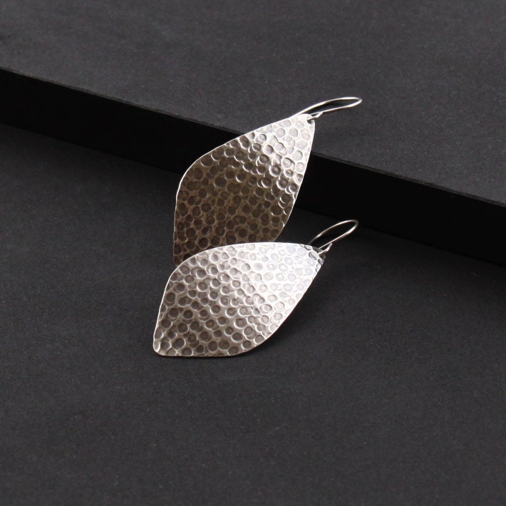 Handmade sterling silver earrings with a streamlined yet unique outer leaf shape and a distinctive hammered pattern - "La Hoja Earrings"