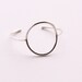 Minimalist silver bracelet of a focal circle shape forged, soldered and hand formed into comfortable, elegant wrist jewelry - "Centre Cuff"