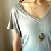 geometric brass rhombus with crystal point necklace