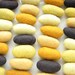 32 felted wool pebbles (dark gray and yellow shades)