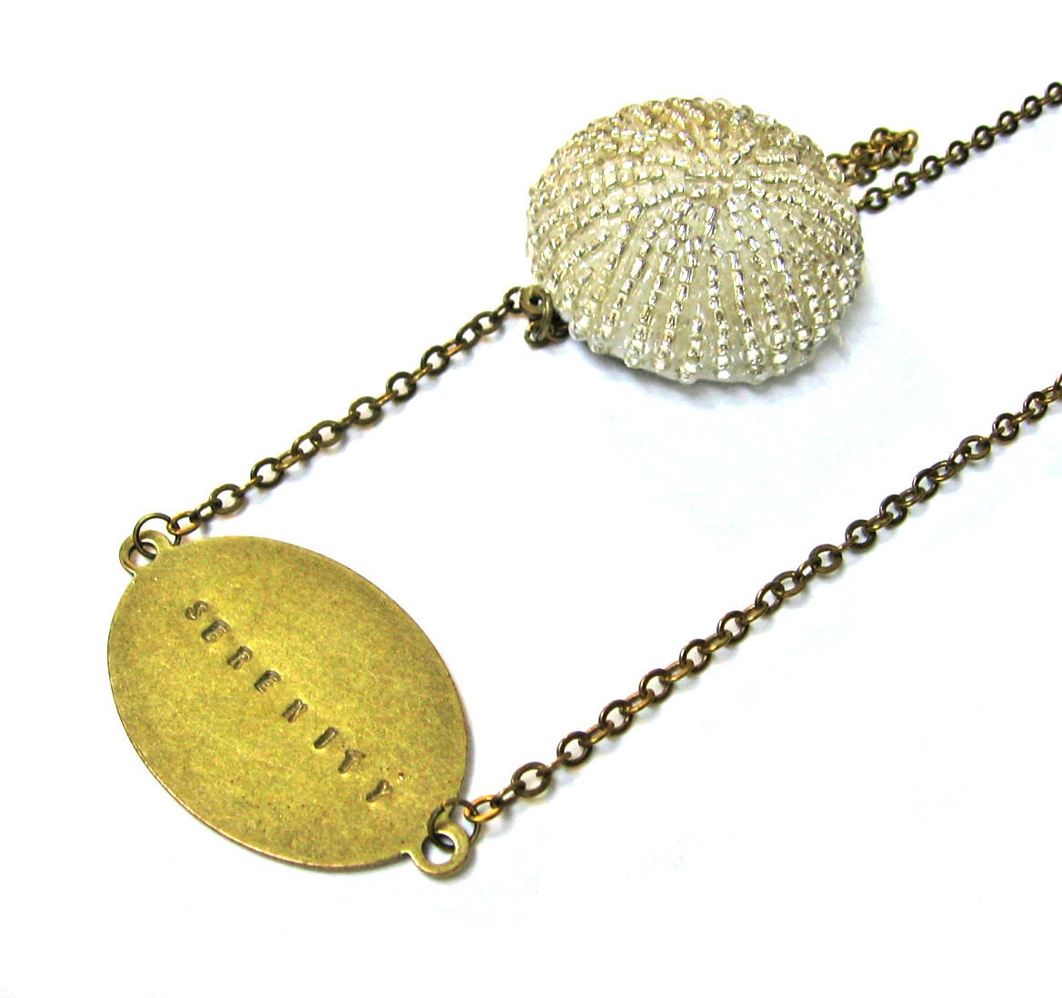 Beaded Sea Urchin in Cream with Metal Stamped Serenity Brass Extra Long Necklace