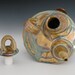 funky footed loopy handle teapot