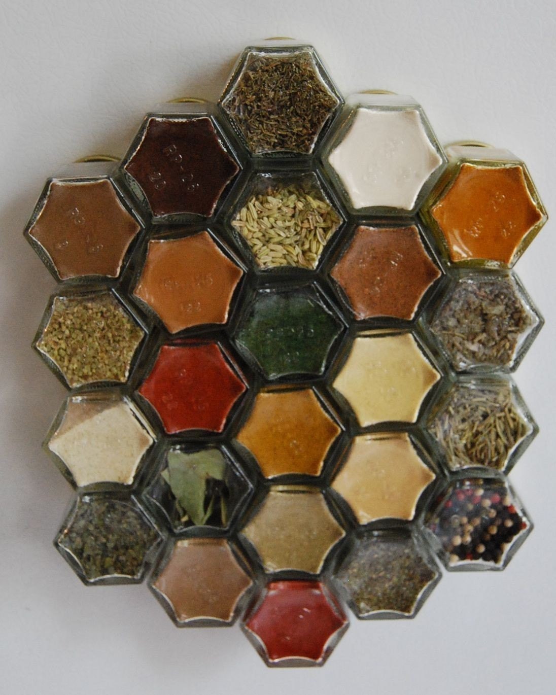 Glass Spice Jars. Customize this Magnetic Spice Rack (set of 24 empty STAMPED jars with your choice of spice names).  Free Shipping.