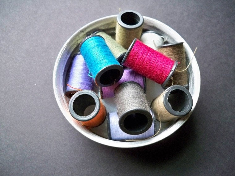 Thread on tiny plastic spools