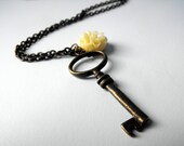 Key necklace brass with yellow flower charm and chain