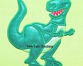 Toy Dino Rex appiqued in 3d holigraphic material on a lime green short sleeved tshirt children and adult sizes