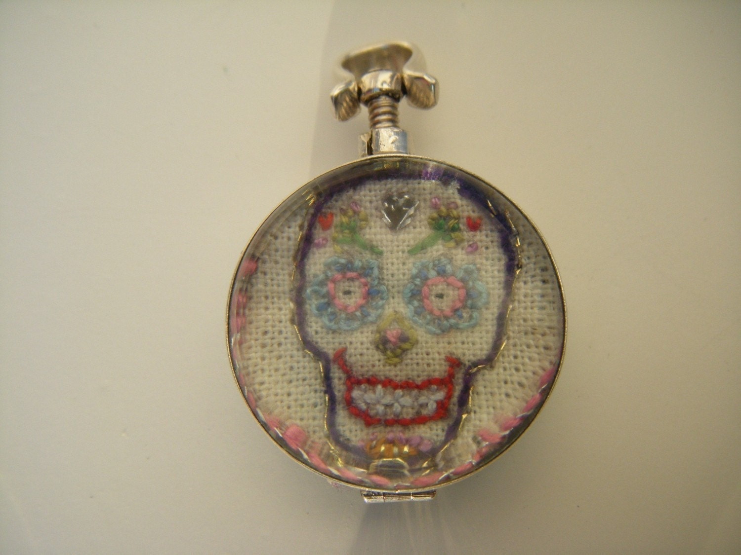 Hand Embroidered  Art Piece in a Two Sided Glass Locket , Sterling Silver Mounted Pendant