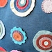 Penny Rug Pillow: Bright Wool Flowers on Blue Denim