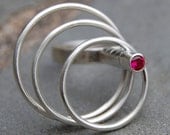 Silver Spinning Ring.  Sterling Silver with Pink Sapphire.  US size 7.