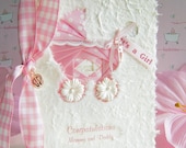 Pink Baby Girl Congratulations Card with Keepsake Charms in Iris Folding of Ribbons