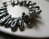 stick pearl and sterling silver bracelet. grey green freshwater biwa pearls, elegant cuff