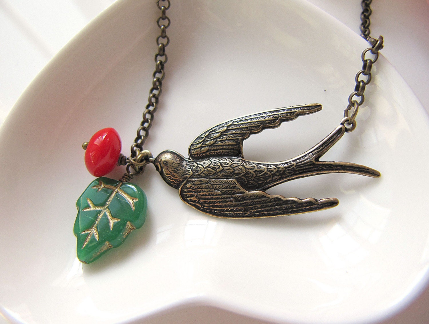 Flying Swallow - Antique Brass detail Swallow Charm and Czech Glass Leaf Necklace
