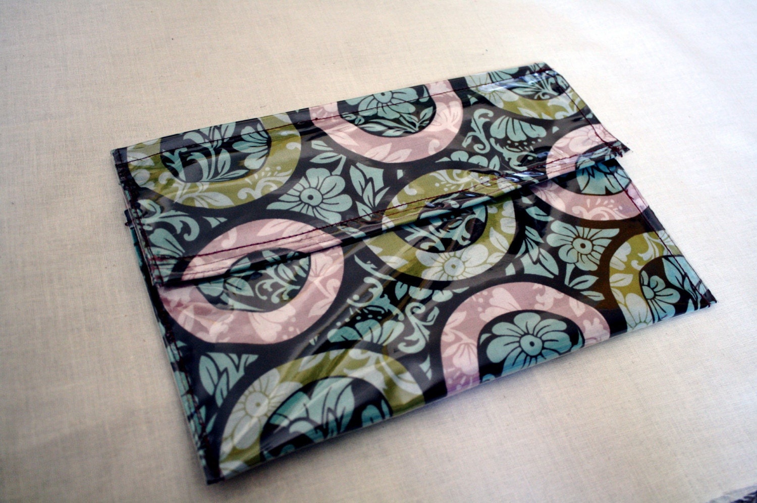 brown pink green and teal envelope clutch