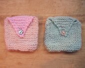 Knitted purses -- in pink or green.
