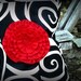 Pleated black and white swirls purse with red rosette