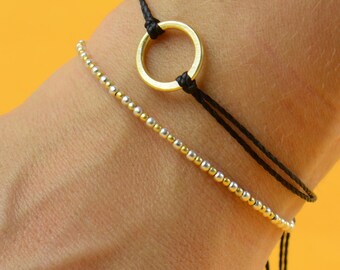 Gold and silver    bracelet . black