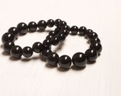 One pair of Cannon Ball Black beaded Bracelet