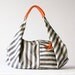 Kallia in Striped canvas and Orange leather details
