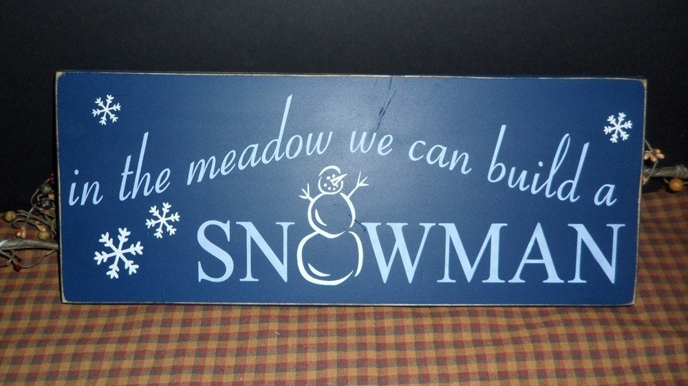 in the meadow we can build a SNOWMAN primitive wood sign