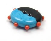 Handmade lampwork glass button  -  Turquoise and Black  -  orange dots