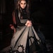 The Gearwerks dress by Steampunk Couture. Grey underbust dress and black high collar bib top Victorian gears