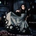 The Gearwerks dress by Steampunk Couture. Grey underbust dress and black high collar bib top Victorian gears