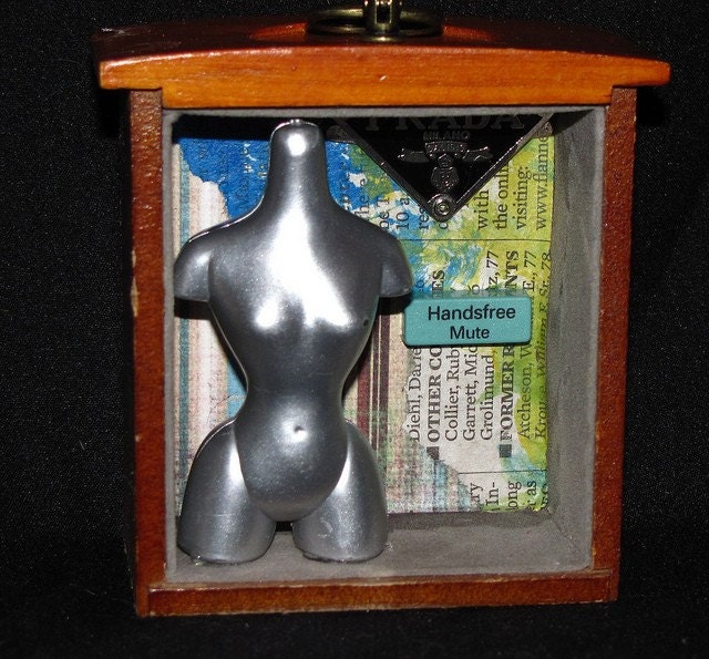handsfree mute, a mini shadow box, made from found objects