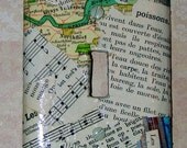 a mini collage decoupaged onto a light switch cover