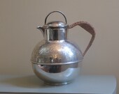 vintage silverplate pitcher with rattan handle