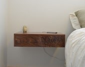 Floating bedside tables in walnut, dovetailed drawers.  nightstand
