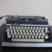 Navy Blue and Grey Adler J5 Typewriter.