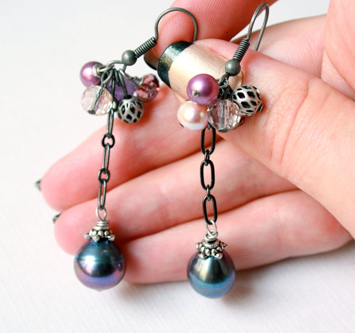 Violet Bouquet Earrings with large black pearl drops on elongated gun metal chain with crystals, amethyst, peach pearl and lacy metal beads,