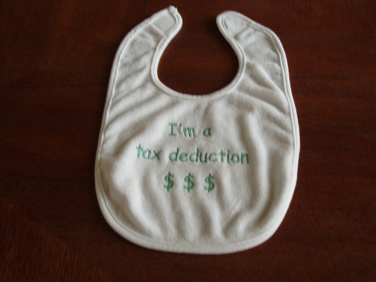 Embroidered baby bib with saying- I'm a tax deduction