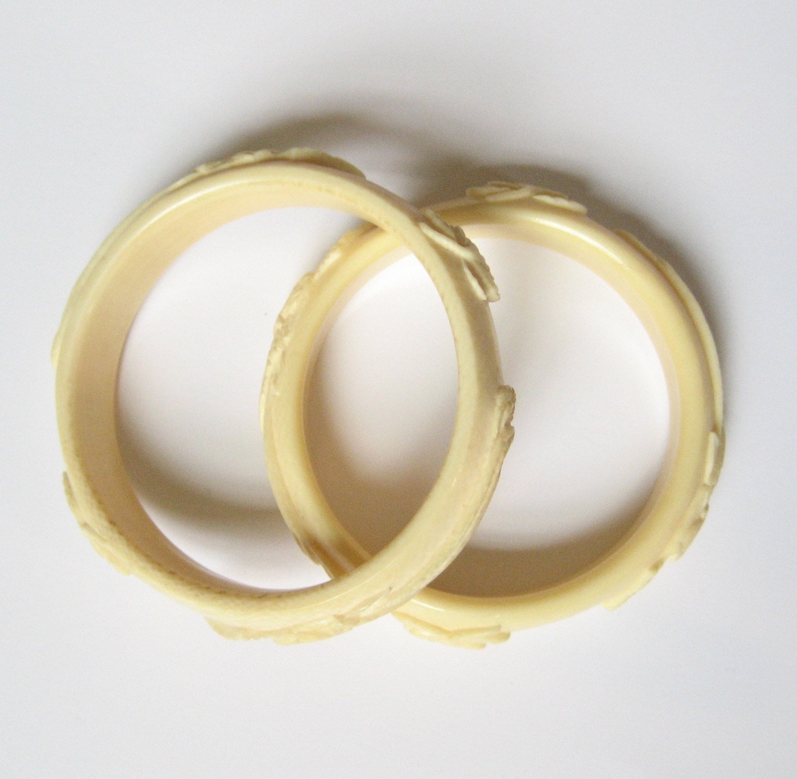 Pair of Carved Pre Ban Ivory Bangles with Phoenix' and Lotus Flowers