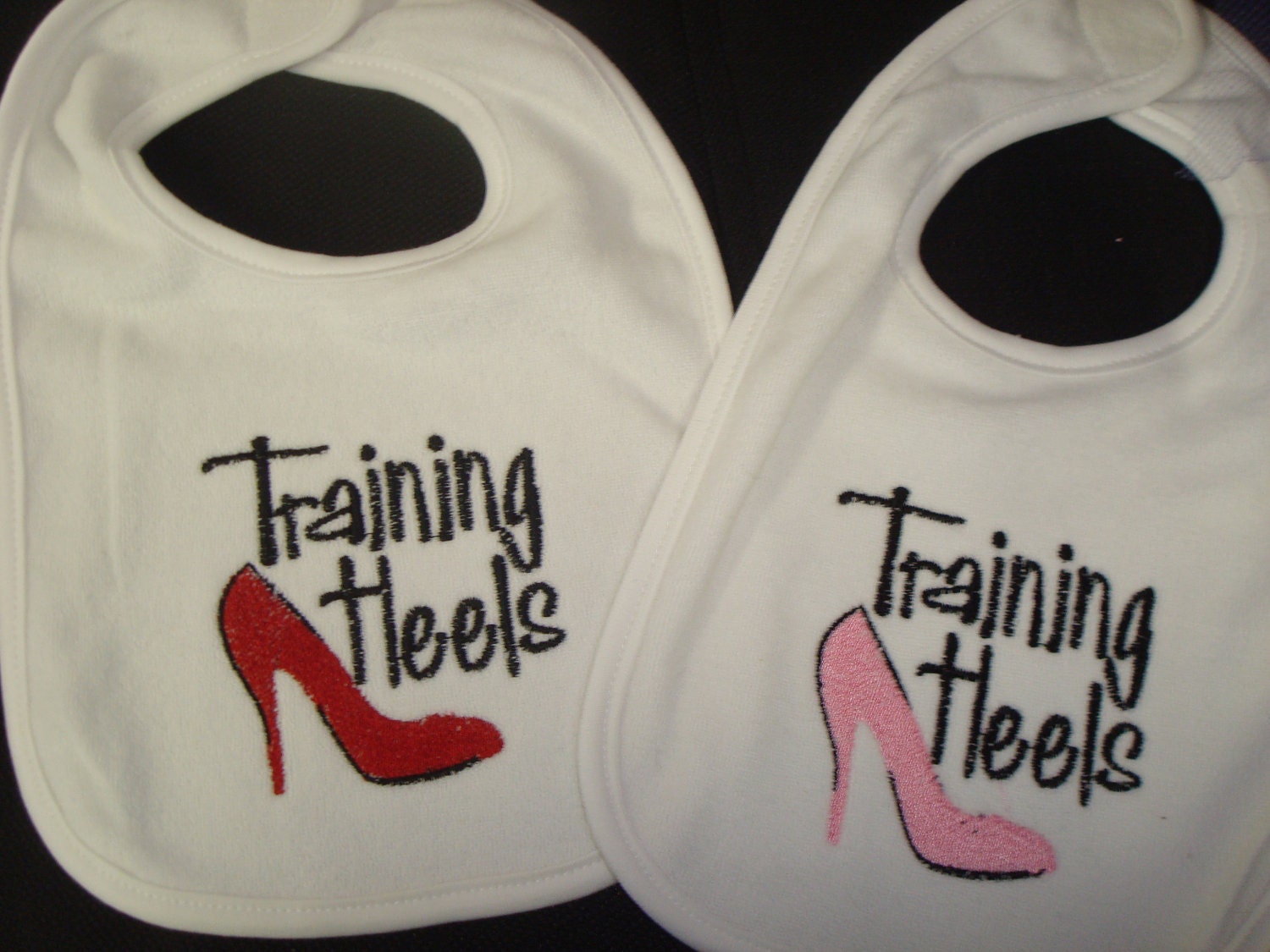 Training Heels Embroidered Bib (available in red or pink)