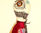 Fabric Monster Doll with stitching and vintage fabrics.