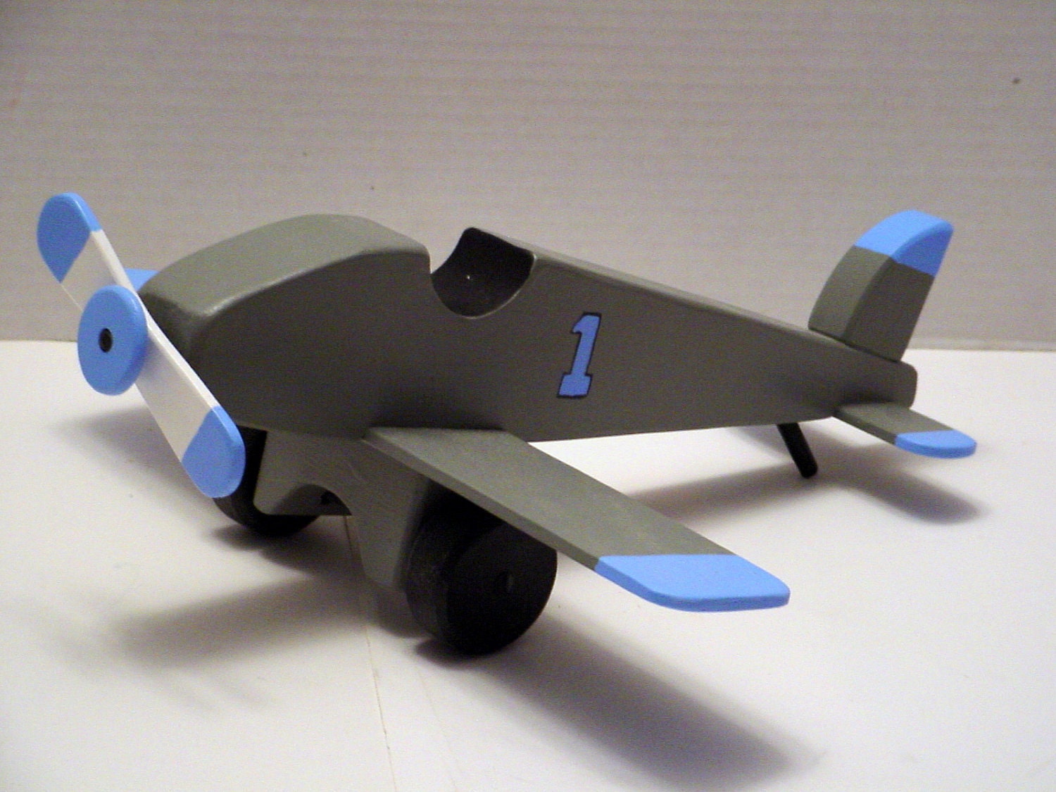 Airplane with Turning Propeller in Gray and Baby Blue