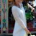 Creamy open-back cotton Milk and honey LeMuse dress with little black bow on the back