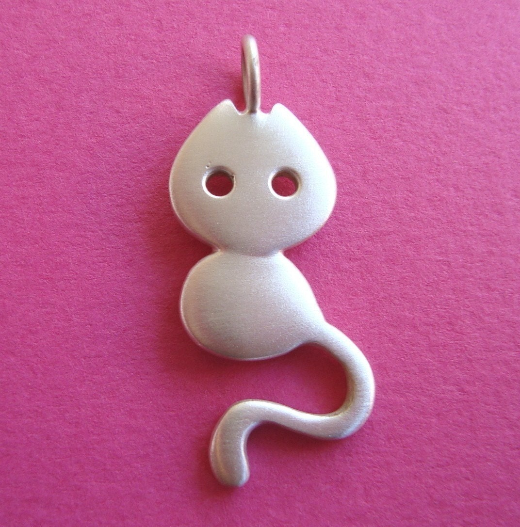 Little cat with leather cord