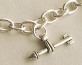 the hunger games arrow charm