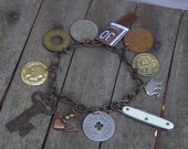 ALMA, and The World traveling Circus Act. Vintage Coin, Key, Pocket Knife, Sterling Elephant Charm and Curious Trinkets Bracelet.