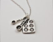 The Baker's Necklace - Measuring Spoons and Baking Pan
