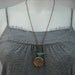 flower tree locket with turquoise bird necklace