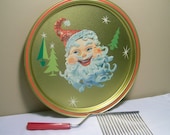 Santa Claus Holiday Tray And Cherry Red Bakelite Cake Cutter, Plastic ,Vintage Star burst graphics