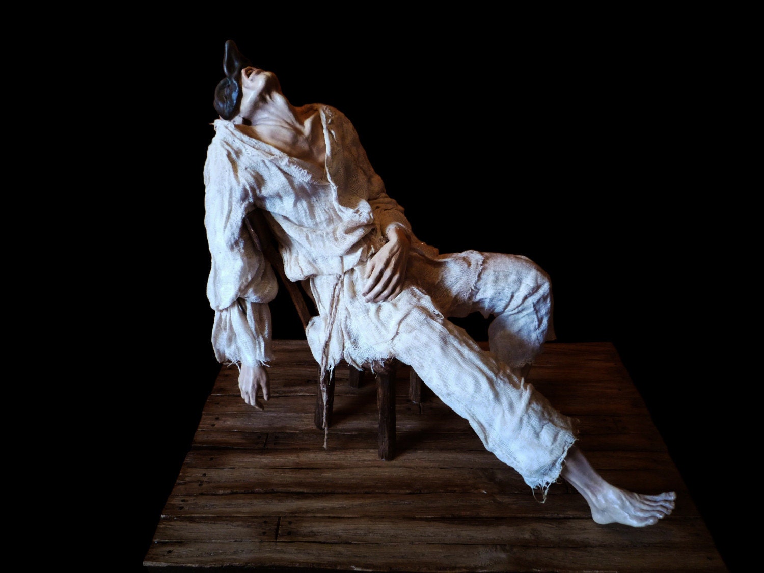 Mixed media sculpture (clay, fabric, wood).Traditional italian character - Pulcinella, Drama