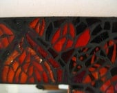 mosaic mirror in reds and oranges