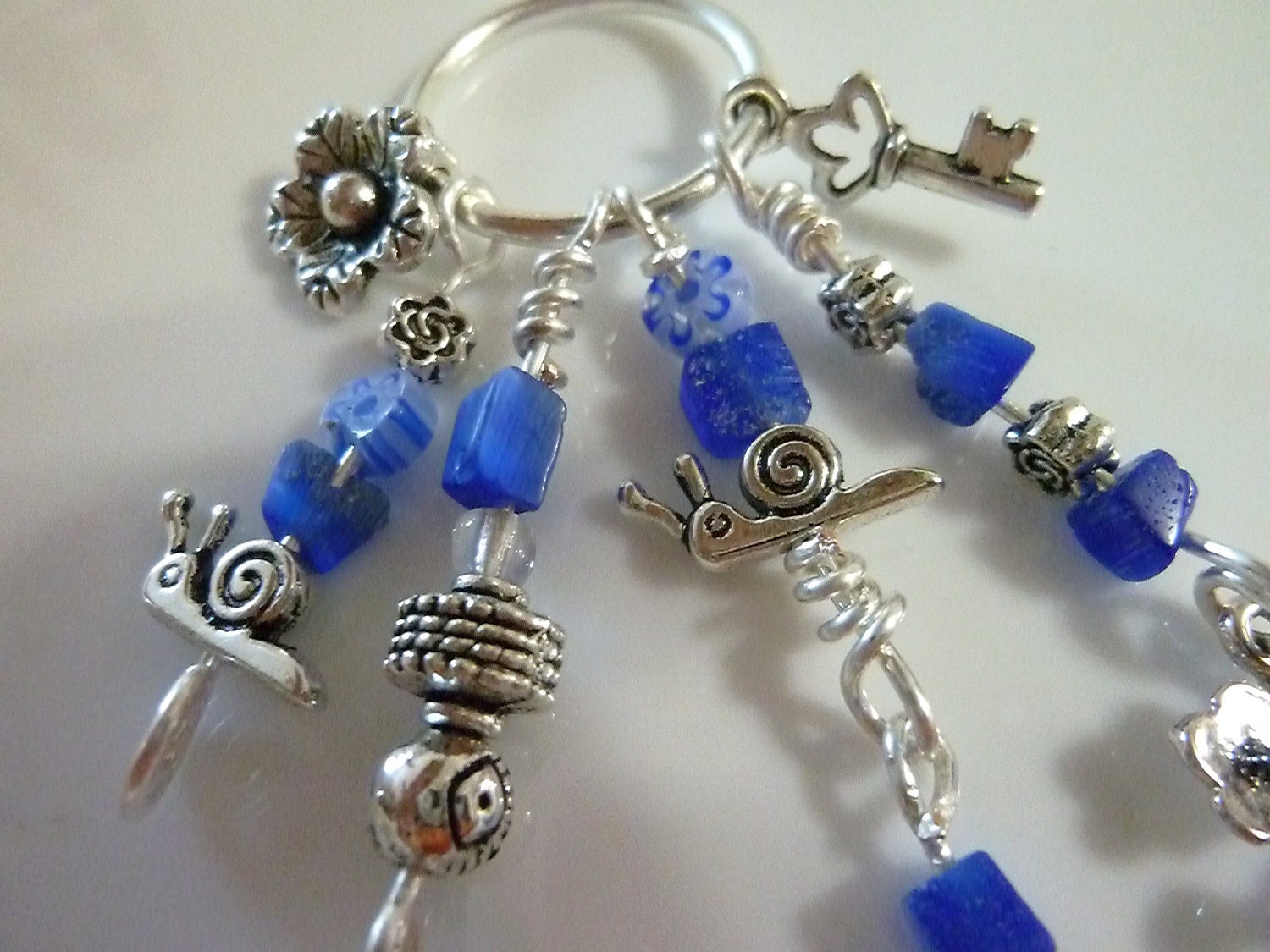 Secret Garden Dangle Keychain in Silver and Blue with Charms - snake, snail, flowers
